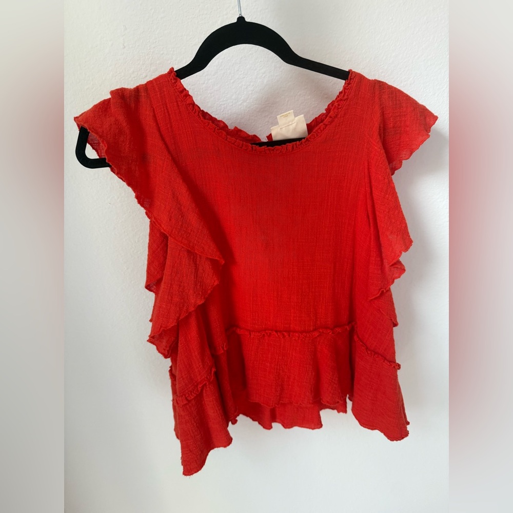 Bright orange ruffle top